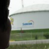 Ada Lockridge looks out her windshield at the Suncor factory which sits beside her home, the Aamjiwnaang First Nations reservation in southern Ontario. Published in The Ecologist, December 1 2006.