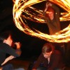 Peter and Katy My friend Peter Farrel spinning fire poi over the head of his sister Katy. I love Katy's nonchalance, ignoring her brother's attempt to disturb her. July 2 2006.