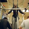 Biomedical engineers help paraplegic Raymond Daniel to walk along a treadmill by using electrical stimulation to move his muscles, in the hope of helping him to one day move them on his own. Published in The Varsity, November 17 2003.