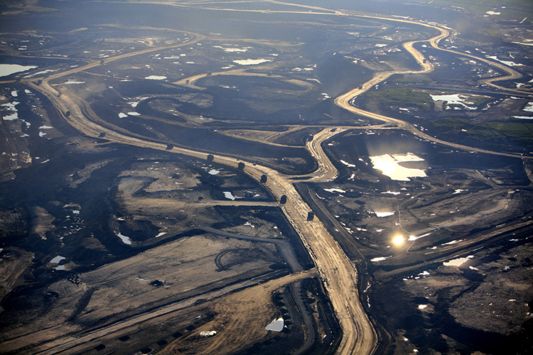 Suncor Millennium tailings pond and tarsands mining operations north of Fort McMurray, northern Alberta, Canada, July 2009. Photo Credit: Jiri Rezac, Courtesy of Greenpeace.