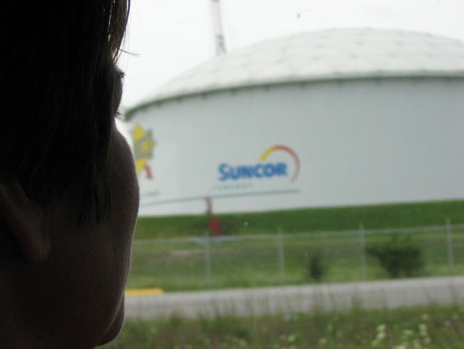 Ada Lockridge, a member of the Aamjiwnaang First Nation in southern Ontario, overlooking the Suncor refinery sitting on land that once belonged to her community.